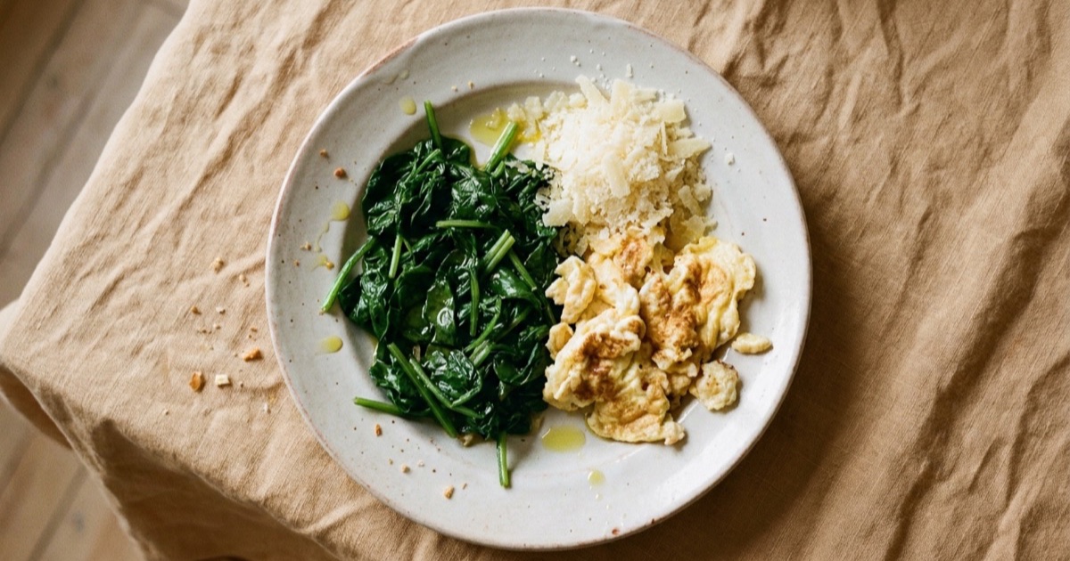 Eggs with spinach — eggs, spinach, hard cheese on a plate built around the Harvard Healthy Eating Plate